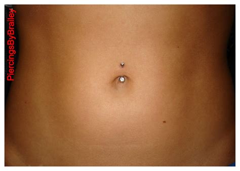 high waisted navel piercing.